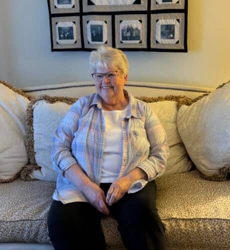 edgewood gables resident sitting on couch
