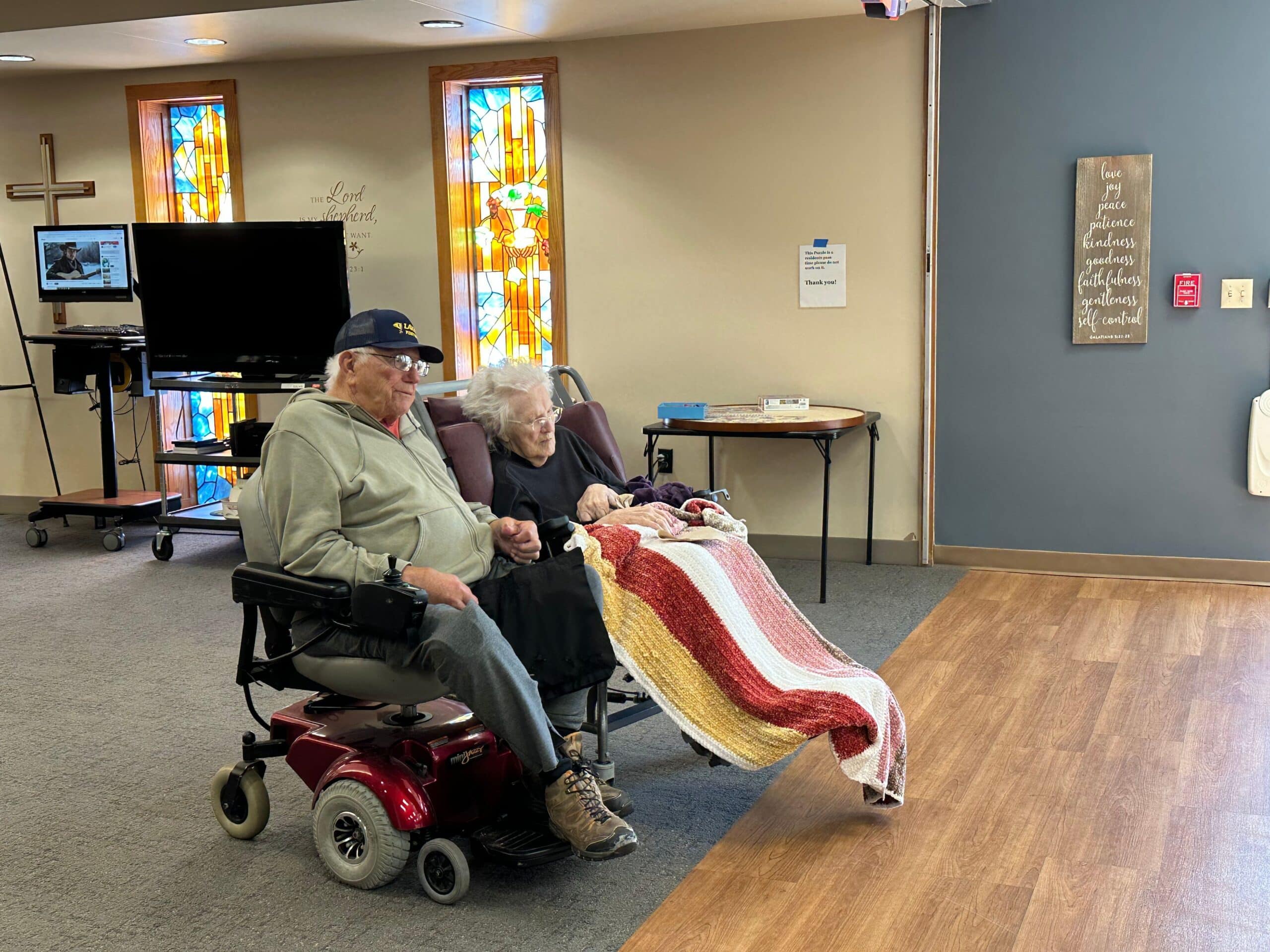 couple holding hands at Cokato Manor