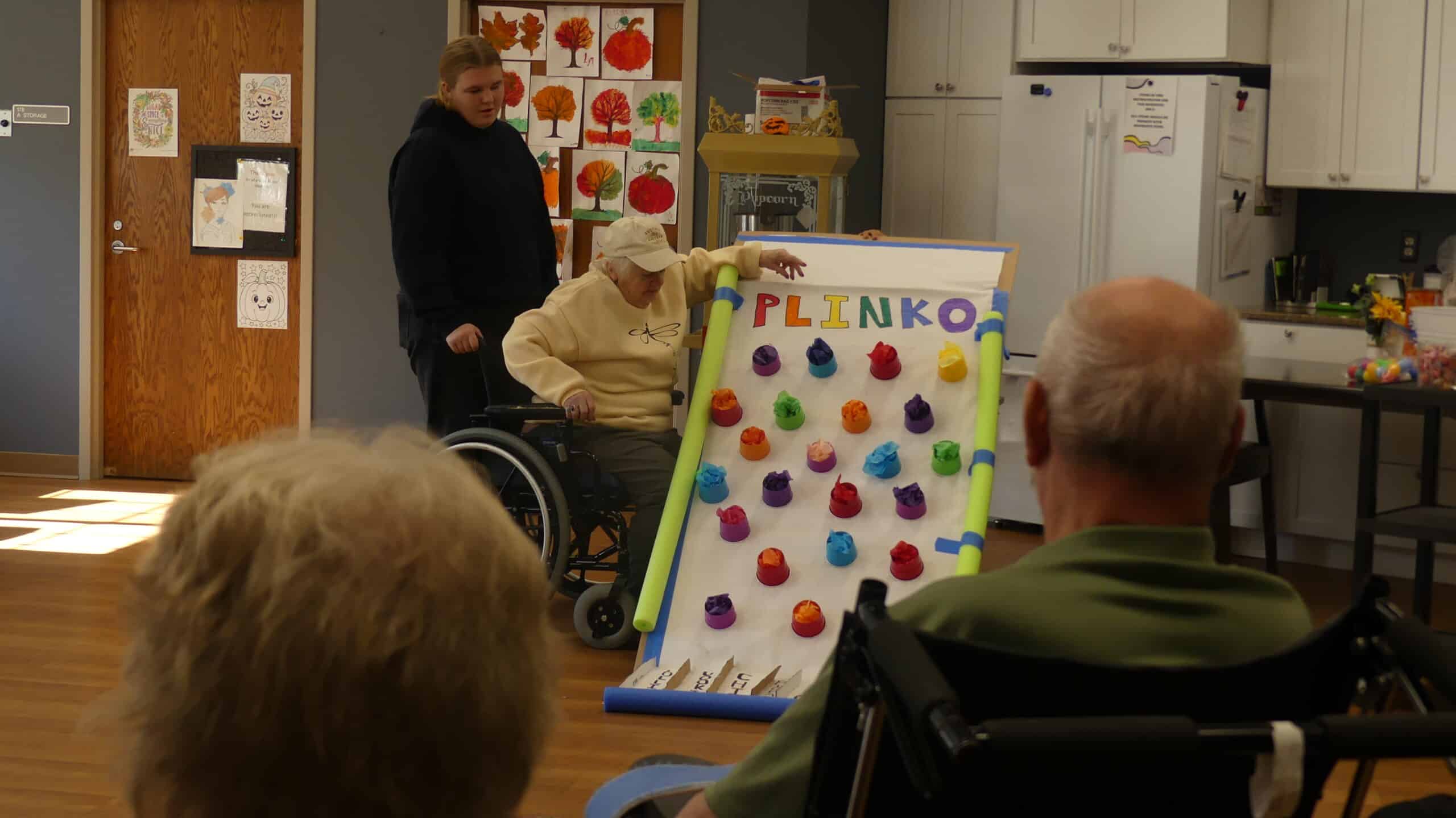 cokato manor patients in activities room playing plinko
