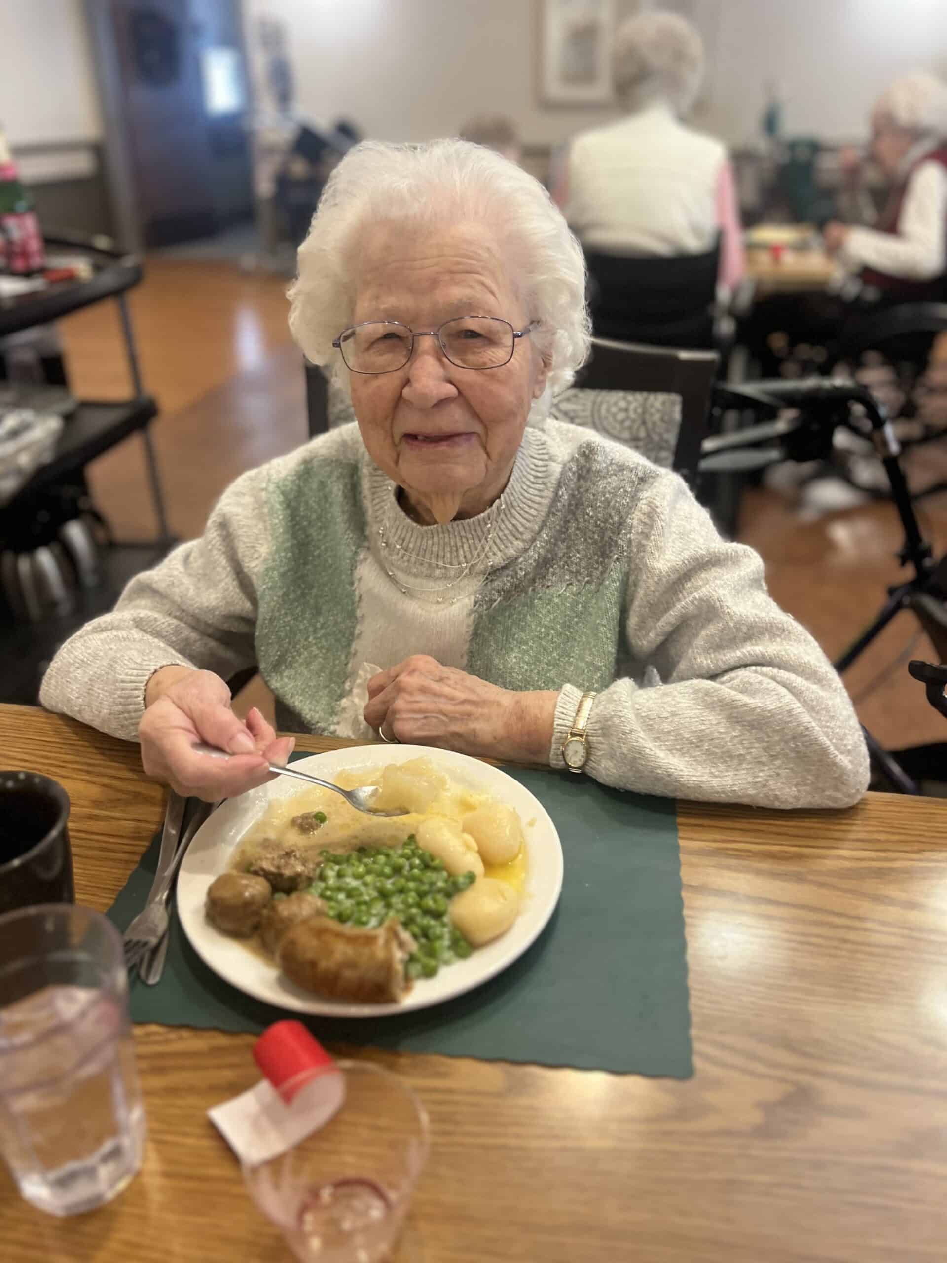 elder eating diner plate