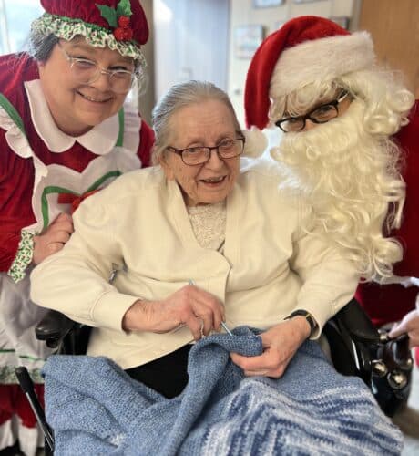 elder with ms claus and santa clause
