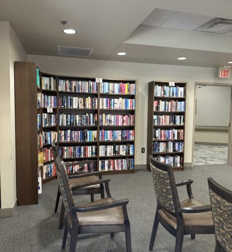 library with shelves of books at cokato manor