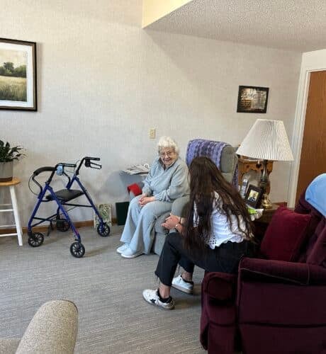 resident chatting with aid at Brookridge assisted living