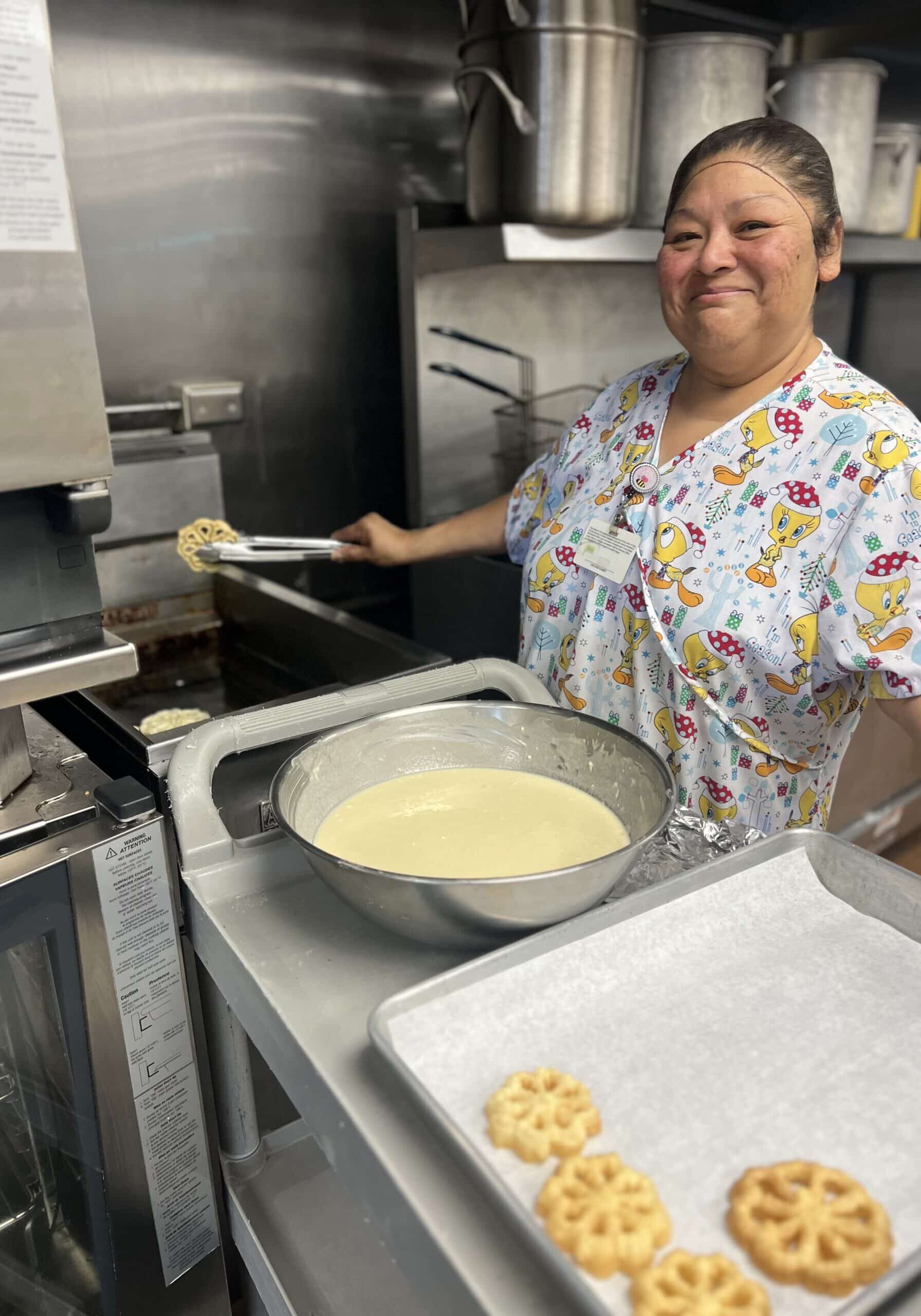 a women frying dough