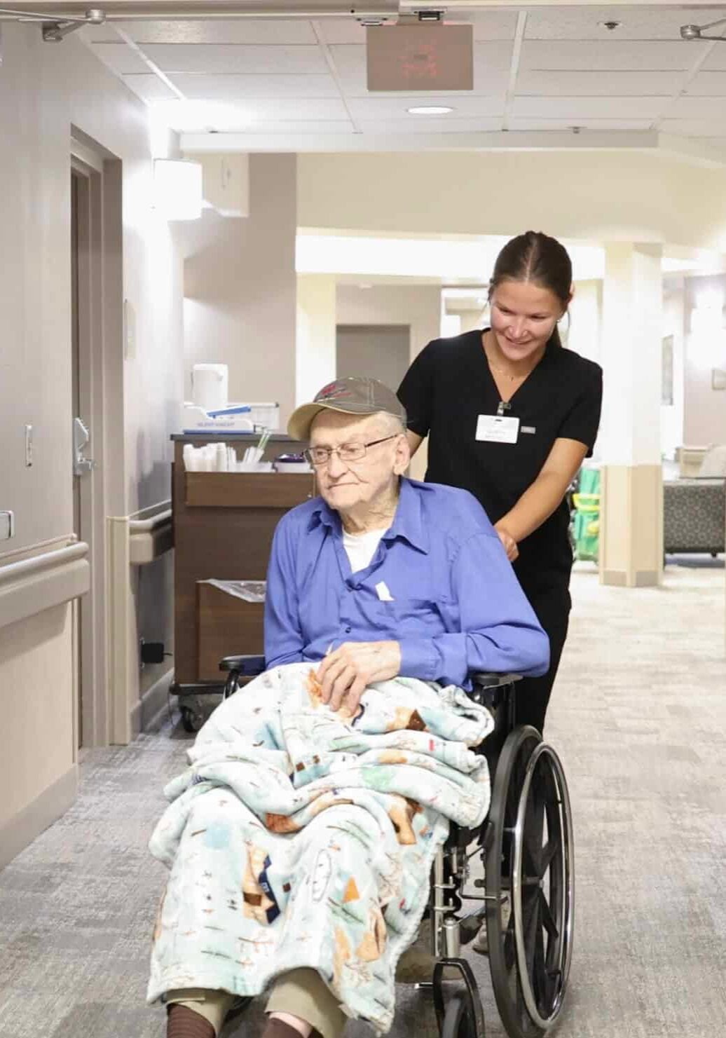 cokato-charitable-trust-staff-member-pushing-resident