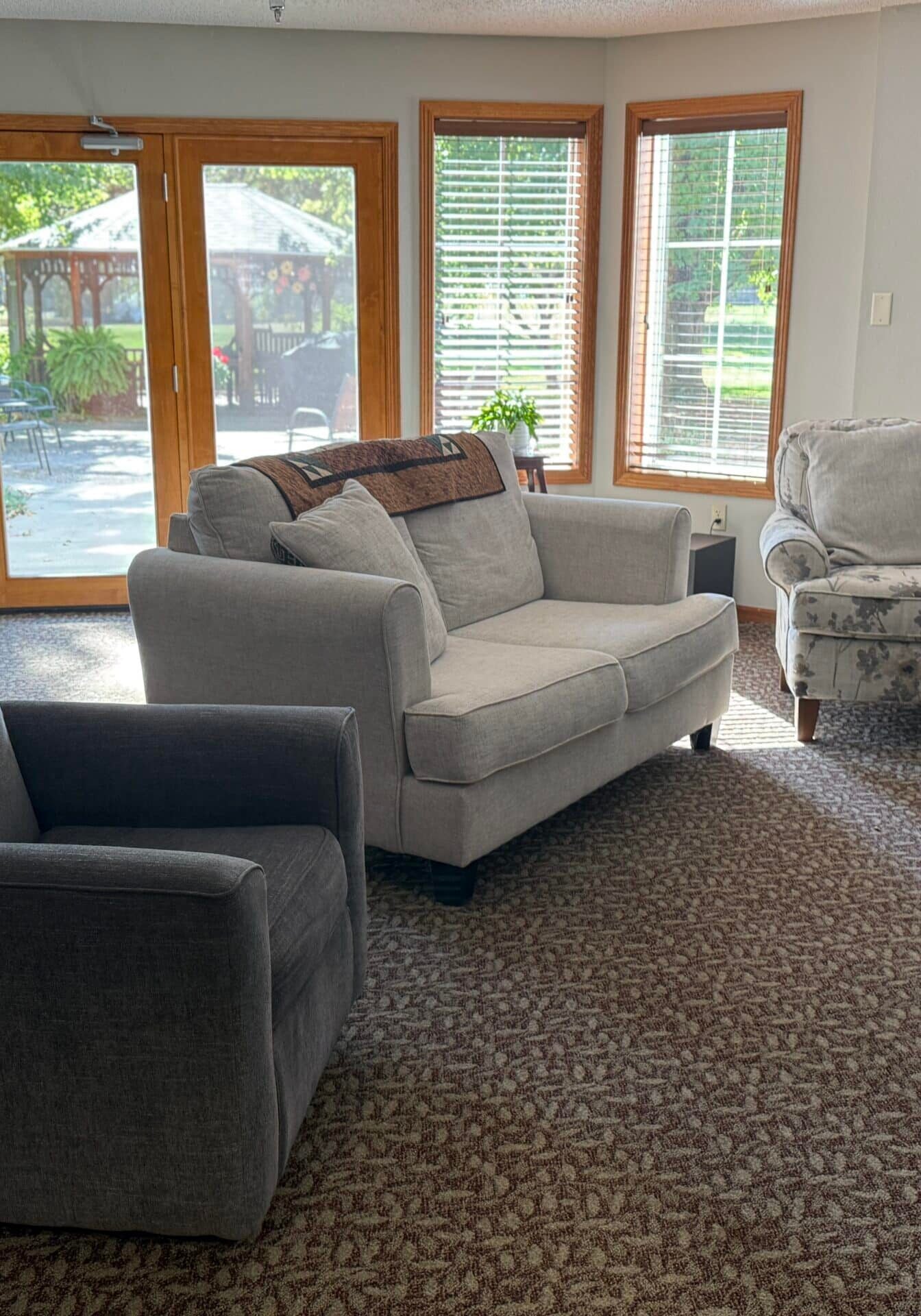 comfortable chairs in front of bay window