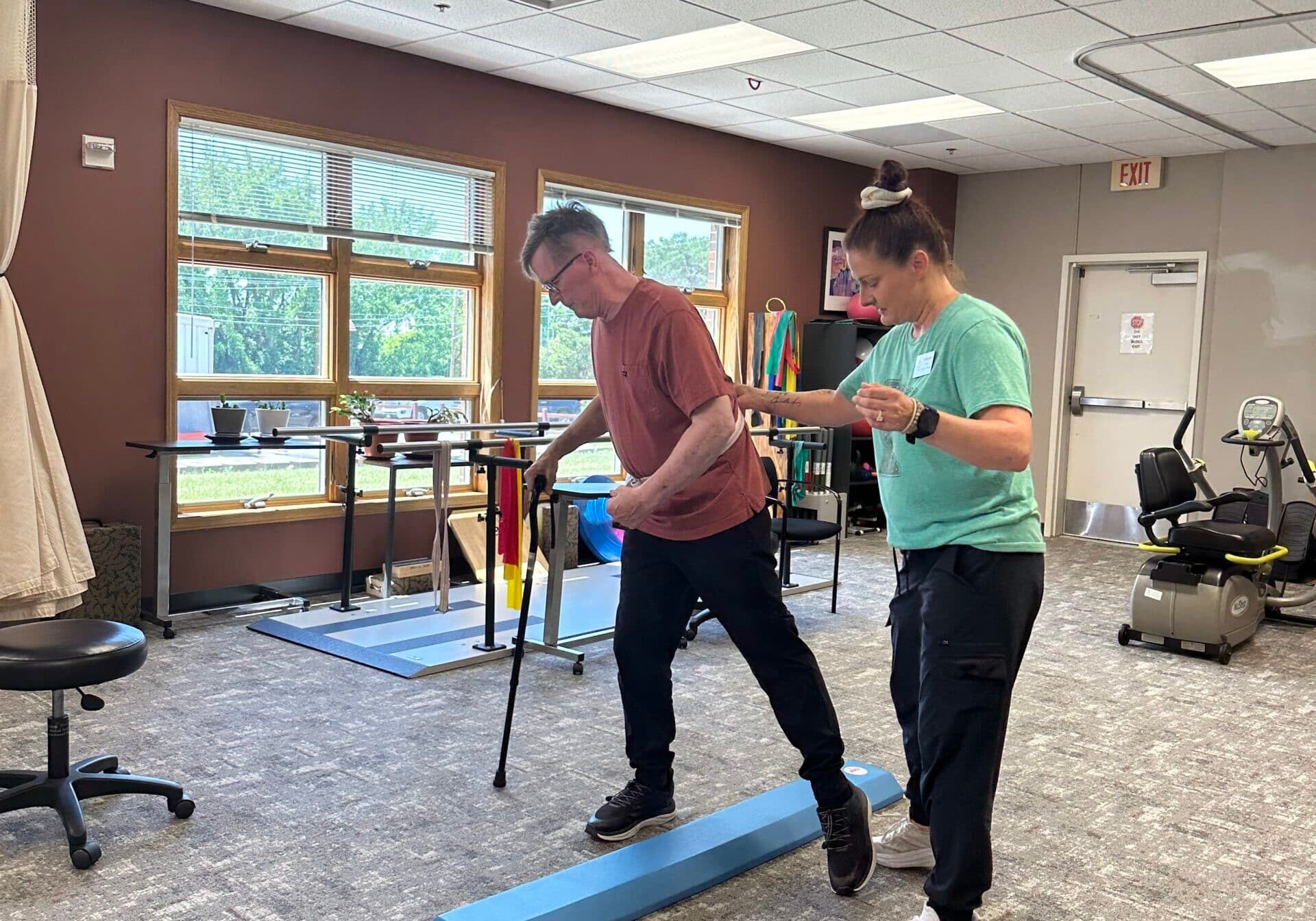 man receiving rehab treatment at rehabilitation facility