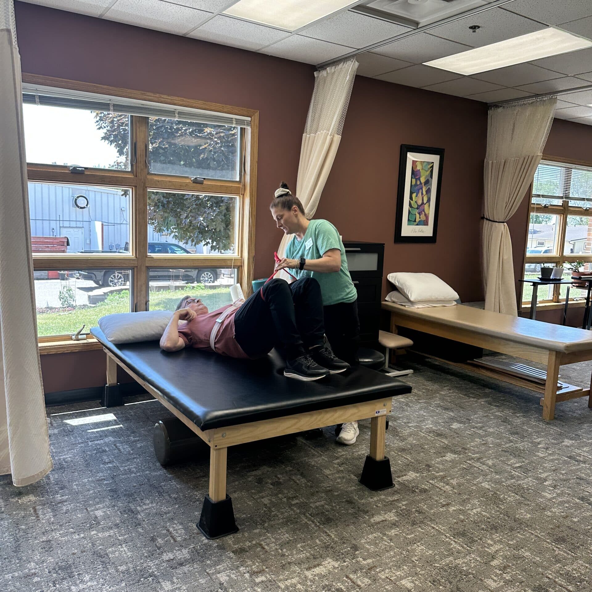 patient on rehab table at rehabilitation facility