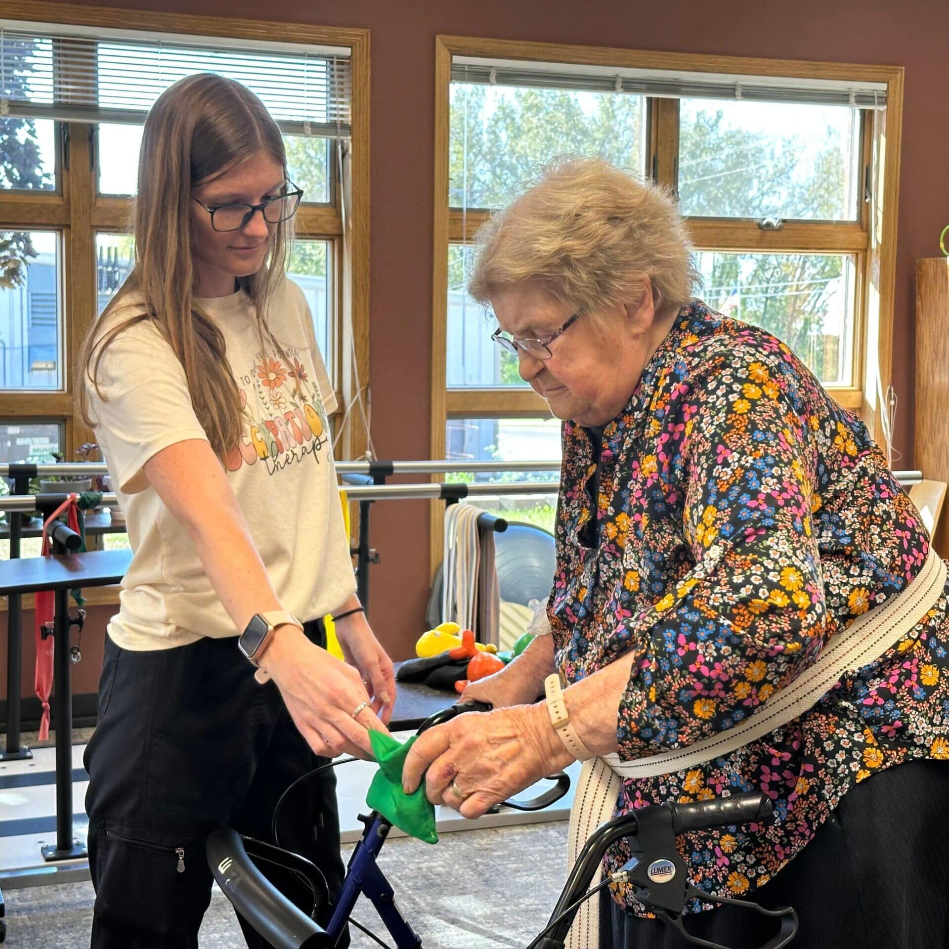 resident doing physical therapy with nurse