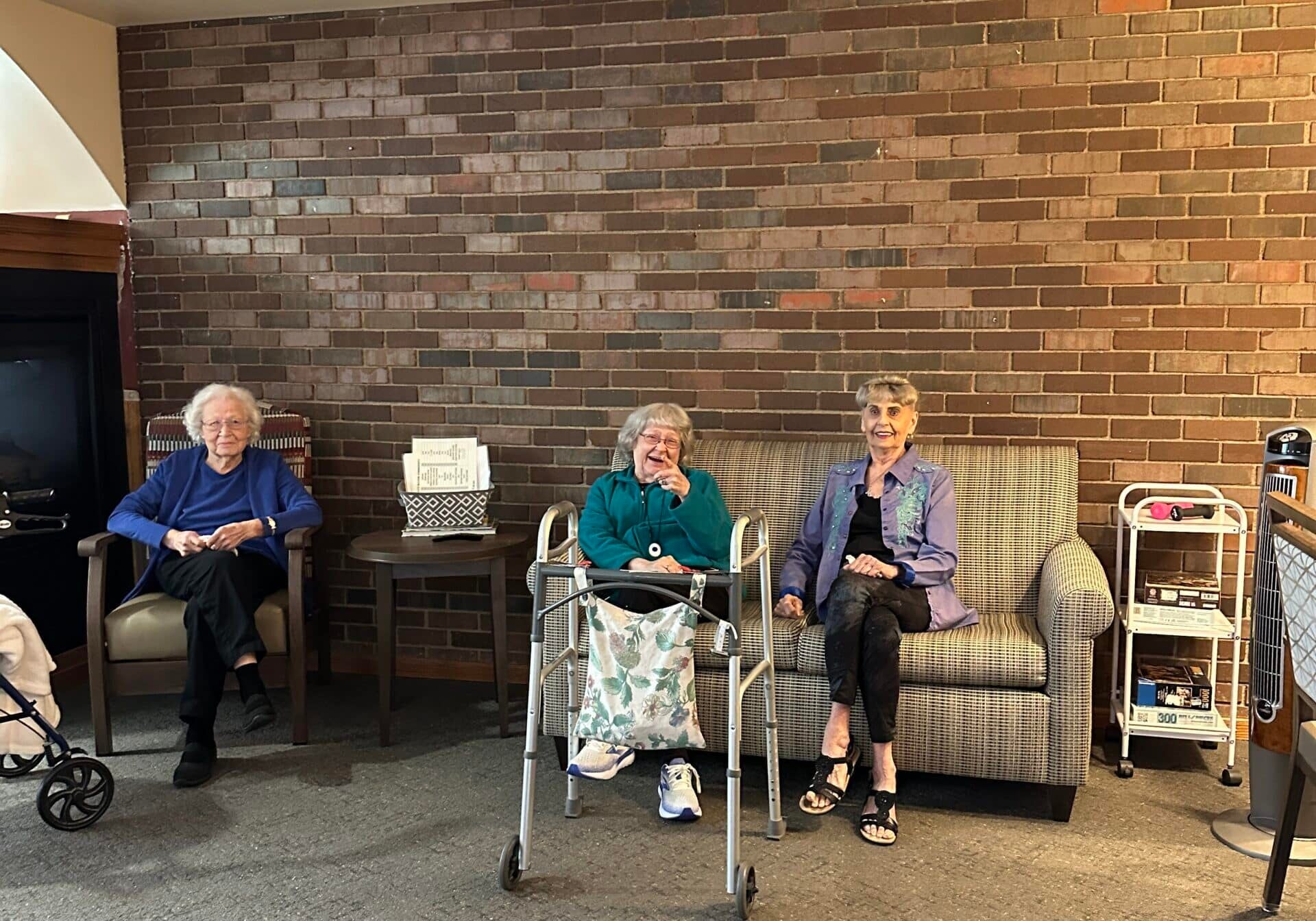 residents sitting in commons at brookridge assisted living